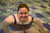 Woman with learning disability in swimming pool