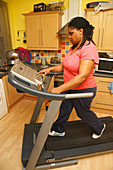 Portrait of black woman on a treadmill