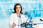Student in CNC and robotics laboratory
