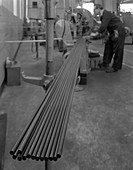 Cutting steel rods to length, 1964