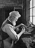 A watch cap maker at work, 1911-1912