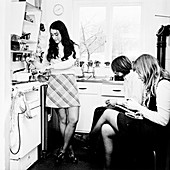 Three young people in the kitchen of a London flat, c1960s