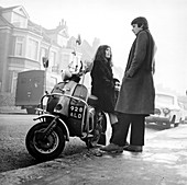 Couple with a scooter, London, 1967