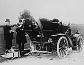 Men having tea beside a 1901 Panhard