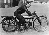 F Ball riding a 1913 Douglas motorbike