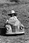 Girl in a 1948 vintage Austin J40 pedal car