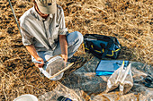 Soil scientist bagging soil samples