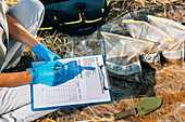 Soil scientist taking notes