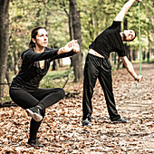 Couple exercising in park