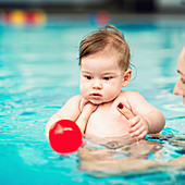Baby boy in swimming pool