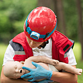 CPR training on baby dummy