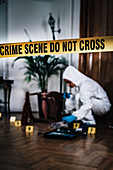 Forensics expert collecting evidence