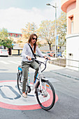 Young woman on electric bicycle