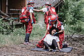 Paramedics rescuing woman