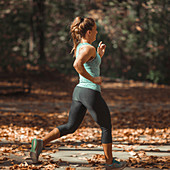 Woman jogging in public park