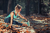 Woman stretching in the park