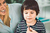 Homeopath giving remedy to child