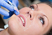 Woman having hyaluronic acid injections