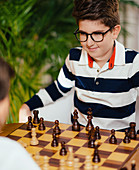 Two boys playing chess