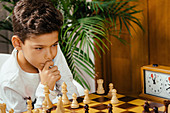 Schoolboy playing chess