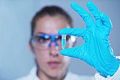Scientist holding micro test tube