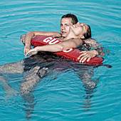 Lifeguard rescuing woman