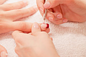 Woman having manicure