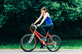 Woman cycling in a park