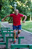 Fit senior man exercising in a park