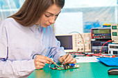 Engineer working on circuit board