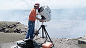 Volcanologist surveys lava lake