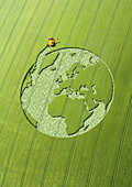 Globe crop circle in green field, illustration