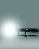 Patient on trolley bed moving towards light, illustration