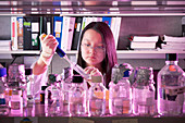 Scientist pipetting sample
