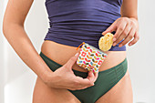 Woman holding a menstrual sponge