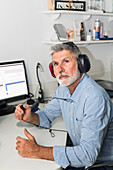 Man undergoing pure-tone audiometry test