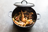 Roasted rabbit cooked in a cast iron casserole