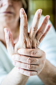 Senior woman suffering from pain in the hand