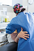 Nurse with patient in an operating room