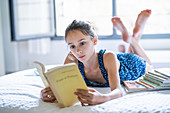 Young girl reading a book