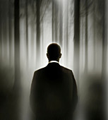 Business man in misty forest, conceptual illustration