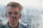 Businessman looking through window