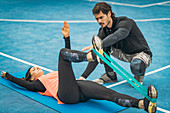Young woman exercising with resistance band