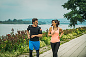 Fit young couple jogging outdoors