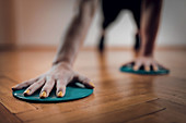 Female athlete exercising with sliding discs