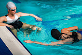 Women in indoor swimming pool
