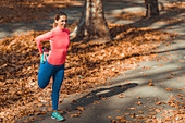 Woman stretching in a park