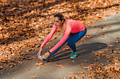 Woman stretching in a park