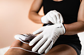 Hand physical therapy with TENS conductive gloves