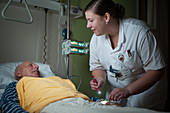 Nurse checking a patient's cannula